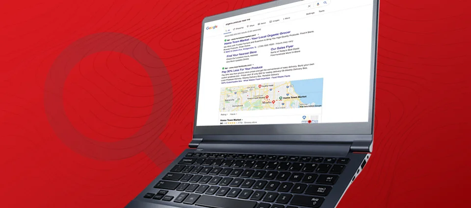 Laptop displaying a Google search results page on a red background with curved lines.