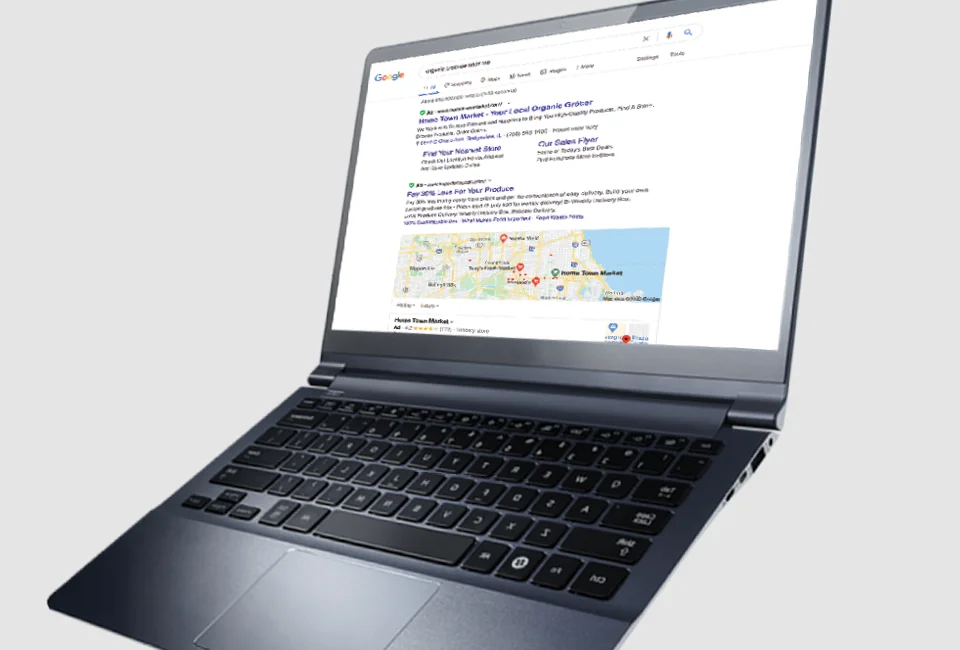 Laptop displaying a Google search results page for "grocery stores near me."