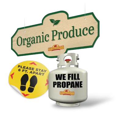 Signs for Organic Produce and We Fill Propane alongside a social distancing decal.
