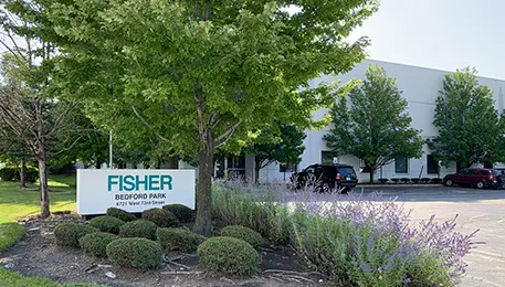 Entrance to a business park with a sign reading Fisher Bedford Park